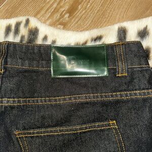 Relaxed Black Jeans with Green Leather Patch